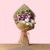 Jute Bouquet of 6 Purple orchids and 5 White Carnations